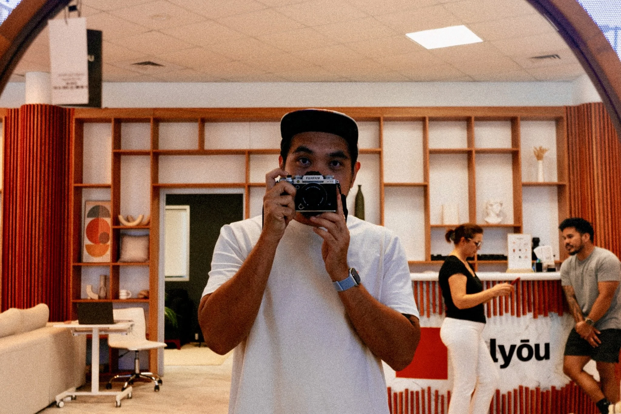 Mark taking a mirror selfie with the Viltrox 28mm f/4.5 pancake lens on his Fujifilm X-T5