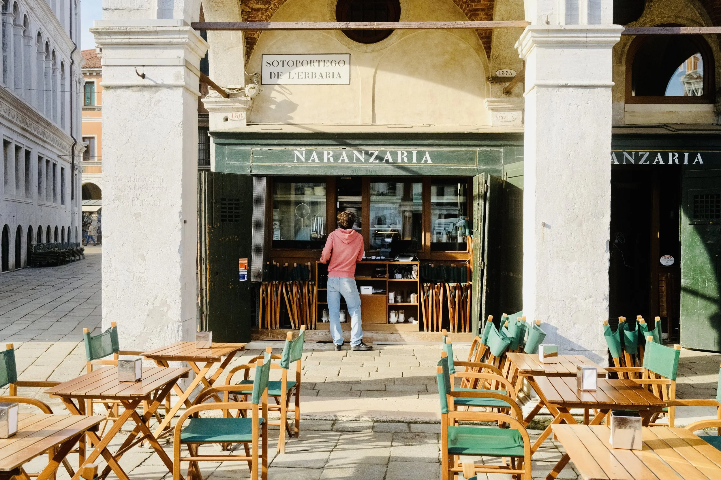Morning light on the Naranzaria cafe terrace near the Rialto in Venice